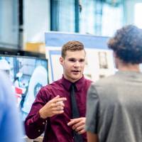 A student discusses the project he worked on